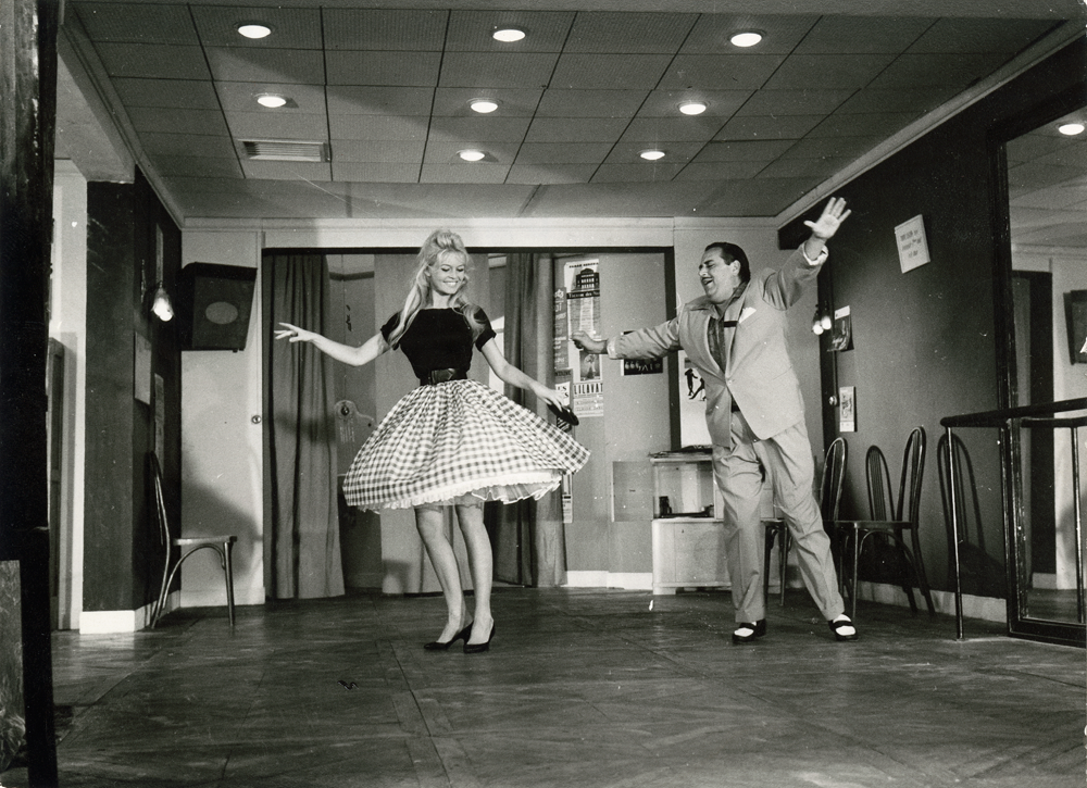 The ‘very lively’ mambo in Come Dance with Me! Brigitte is dancing with Dario Moreno in an outfit designed by couturier Jacques Esterel, her hair styled by Carita. © Cinémathèque française, from Brigitte Bardot: My Life in Fashion (Flammarion, 2016).